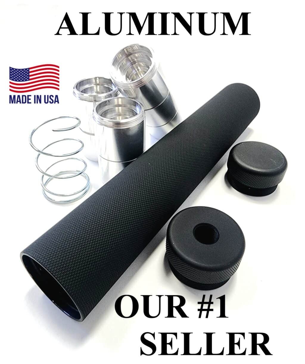 Close-up of the D Sized Aluminum Solvent Trap Kit with Flat Adapter by Freedom Gear, displaying an 8.5-inch, 1.5-inch diameter aluminum tube with full diamond knurl and anodized black finish. Includes a flat-style 1/2 x 28 or 5/8 x 24 thread adapter, solid end cap, and 7 threaded aluminum cups with a spring, arranged on a white background, showcasing durability and tactical design for firearm maintenance.